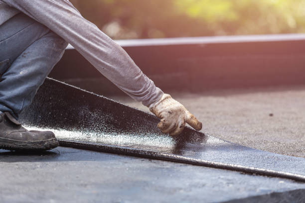 Professional Basement Waterproofing technician working in Hebron, KY